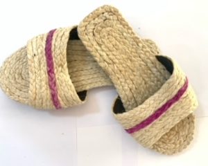 A handcrafted slippers made of pineapple fiber, is an eco- friendly and sustainable footwear option. These slippers boast a natural golden hue and are known for softness and breathability. Pineapple fiber slippers are a unique and comfortable choice for concious consumer.